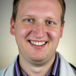 a professional and visually appealing image of a young happy smiling caucasian doctor with white teeth