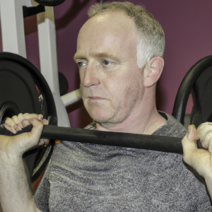 a professional appealing image of a caucasian man or woman exercising in a gym