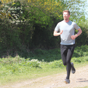 a professional appealing image of a caucasian man or woman jogging on a sunny day 181 300x300