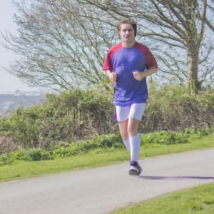 a professional appealing image of a caucasian man or woman jogging on a sunny day 409 300x300