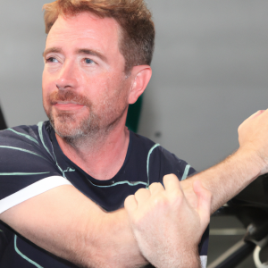 a professional appealing good looking and atheletic image of a caucasian man exercising in a gym