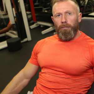 a professional appealing good looking and atheletic image of a caucasian man exercising in a gym