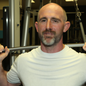 a professional appealing good looking and atheletic image of a caucasian man exercising in a gym 847 300x300