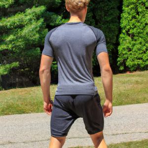 a professional appealing good looking and atheletic image of a caucasian man exercising or playing sports outside on a sunny day